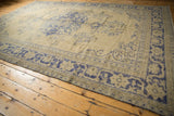 Distressed Vintage Oushak rug, faded cobalt blue roundel medallion, pale antique ivory field.