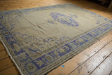 Distressed vintage Oushak carpet border, with faded cobalt blue leaf and palmette motifs.