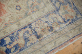 Distressed Oushak rug detail showing faint foundation, vibrant cobalt blue, and pale blush.
