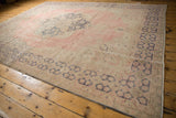 Distressed Oushak rug border, Rococo inspired pale blush and dusty navy patterns, worn pile.
