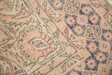 Rococo inspired pale blush, dusty navy, ivory distressed Oushak carpet pile texture.