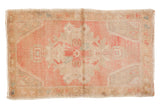 Distressed vintage Oushak rug mat, Rococo pink medallion, faded ivory field, 1'10