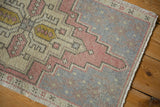 Distressed Turkish Oushak rug, worn knot heads, faint foundation, slate gray and dusty rose design.