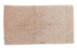 Vintage distressed Oushak rug mat, faded floral medallion in neutral tones.