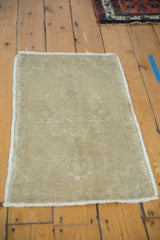 Reverse of the hand-knotted vintage Oushak rug showing tight foundation and beige tones.