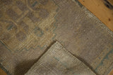 Hand-knotted foundation, fringe, and distressed texture of the rug pile.