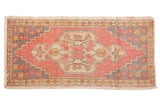 Vintage Distressed Oushak rug with faded red field, ivory medallion, and grey floral spandrels, 1'10