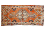 Vintage distressed Oushak runner, diamond medallion, faded orange-red, ivory, charcoal. 2'7