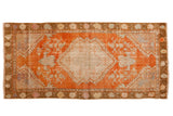 Distressed Oushak runner, pale rust field, ivory medallion, delicate floral tendrils, 2'4