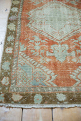 Distressed vintage Oushak runner, delicate floral tendrils, faded rust, mint foundation showing.