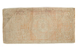 Distressed Oushak rug in ivory and faded blush red with stepped diamond medallion.