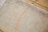 Textured distressed Oushak rug pile in faded ivory, pale blush, and silver tones.