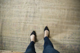 Vintage Distressed Oushak carpet with even wear, visible faint foundation, and muted beige, ivory, faded blue.