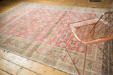 Distressed Sivas carpet corner reveals intricate beige border patterns and blush field wear.