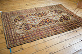Vintage Caucasian rug bottom corner, geometric borders in cherry red, saffron yellow, with edge wear.
