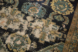 Detail of antique Malayer rug showing worn Herati motif and exposed ivory foundation.
