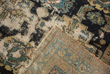Hand-knotted foundation and worn pile of an antique Malayer rug with tattered perimeter.