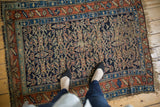 Allover Herati pattern on an antique Kurdish rug, showing visible wear and aged texture.
