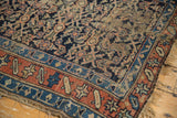 Antique Kurdish rug detail: worn madder root red border, threadbare pile, and tattered fringe.