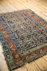 Antique Kurdish rug corner, showcasing madder root red, powder blue borders, and tatter.