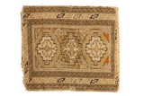 Antique Caucasian square rug with a triple gul medallion design and a geometric serpent border.