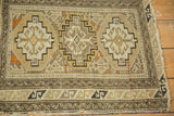 A view of the serpent main border on an antique Caucasian rug showing its even wear.