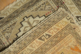 Hand-knotted pile of an antique Caucasian mat showing even wear and the rug's secured side.