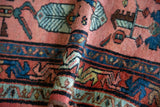 Detail of hand-knotted vintage Lilihan rug pile, showcasing dusty blush, indigo, and mallard green vinery.