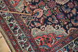 Vintage Tajabad rug corner with Rococo spandrel, mahi-mahi motifs, and cherry red border.