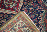 Corner of Vintage Tajabad rug showing hand-knotted weave, fringe, and Rococo-inspired border.