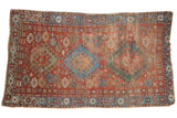 Antique Caucasian rug: triple geometric medallions, red, sky blue, and patinaed green, 3'8