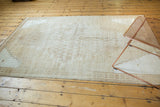 Vintage Distressed Oushak rug corner with stepped spandrel and abrashed field in muted tones.