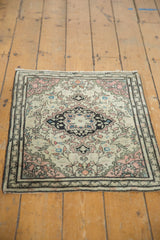 Antique Farahan Sarouk rug's scalloped medallion and delicate vinery in blush, navy, and ivory.