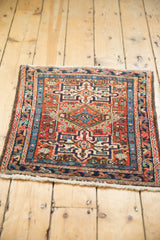 Secured side, light fringe, and brick red geometric pattern of Vintage Karaja rug.