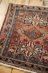 Geometric diamond motif and pinwheel design on brick red vintage Karaja rug.