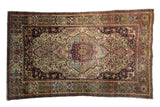 Finely woven Antique Silk Mohtashem Kashan rug, central medallion, gem-tone floral motifs.