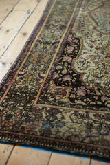 Finely woven aubergine and gem-tone floral motifs on antique Mohtashem Kashan silk.