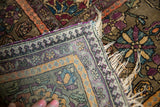 Finely hand-knotted silk foundation and colorful floral pile of this antique Kashan rug.
