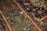 Finely woven emerald green, aubergine floral patterns on antique Mohtashem Kashan silk.