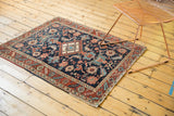 Antique Heriz rug corner, broad floral palmettes, vinery, even wear, and restored selvage.