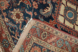 Worn pile, exposed foundation, and professionally restored selvages of an antique Heriz rug.