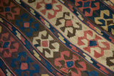 Handwoven antique Persian Kilim with madder red, ivory, blue, brown crab motifs and weave breaks.