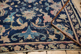Antique Chinese rug: navy field, Persian palmettes, lotus flowers, and vinery.