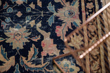 Visible foundation texture of antique Chinese rug, Persian stylized palmettes in navy, beige, pink, aqua.
