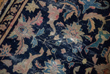 Worn pile and foundation of antique Chinese rug, navy, pink, aqua palmettes, lotus, vinery.