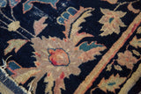 Antique Chinese rug detail: Persian stylized palmettes, vinery on navy, with light tatter.