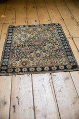 Vintage Farahan Sarouk navy border with antique ivory field and blush trellis motifs.