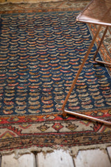 Antique Persian Hamadan rug with navy Mahi Mahi pattern, geometric border, and aged fringe.