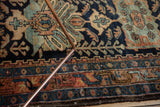 Low pile texture of a Vintage Hamadan rug, showing navy, rust, and sky blue motifs.