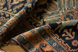Vintage Hamadan rug pile with navy, rust, and sky blue floral motifs and gentle wear.